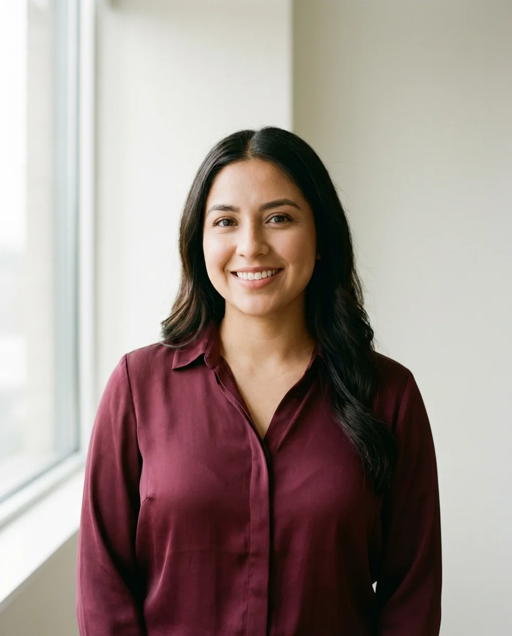 Professional headshot - woman in burgundy blouse