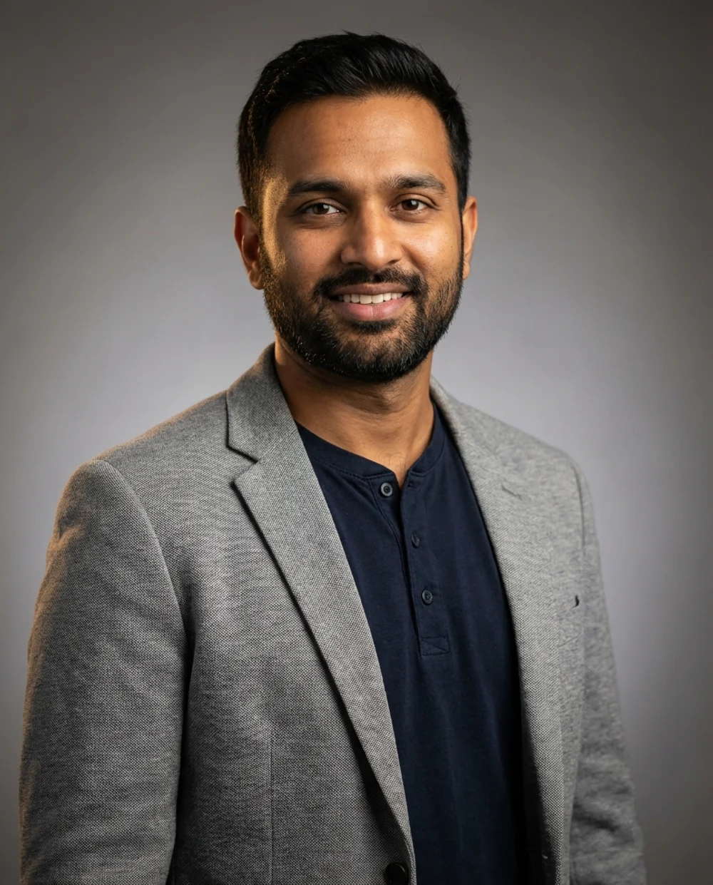 Smart casual headshot - man in gray blazer